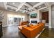Open living area featuring hardwood floors, fireplace, large sofas and access to the balcony at 1110 Briar Cove Cir, Atlanta, GA 30329