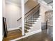 Staircase with hardwood steps and wrought iron railing at 1110 Briar Cove Cir, Atlanta, GA 30329