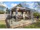 Inviting backyard patio area with comfortable seating and elegant decor, great for relaxing outdoors at 2019 Wiltshire Pl, Snellville, GA 30078