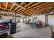 Unfinished basement featuring exposed rafters and concrete floors with a workbench at 2019 Wiltshire Pl, Snellville, GA 30078