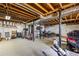 Unfinished basement featuring exposed rafters, concrete floors, and visible utilities at 2019 Wiltshire Pl, Snellville, GA 30078