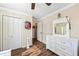 Bright bedroom featuring wood floors, white trim and neutral wall color at 2019 Wiltshire Pl, Snellville, GA 30078