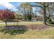 Well-maintained front yard with mature trees and lush green lawn at 2019 Wiltshire Pl, Snellville, GA 30078