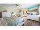 Spacious main bedroom with wood floors, a ceiling fan, and an ensuite bathroom at 2019 Wiltshire Pl, Snellville, GA 30078