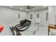 Finished basement with workout equipment, green sofa, neutral carpet and plenty of natural light at 2022 Raven Way, Atlanta, GA 30341
