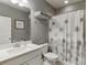 The bathroom features a single vanity, a shower with a curtain, and neutral finishes at 2022 Raven Way, Atlanta, GA 30341
