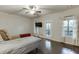 Bedroom featuring wood floors, recessed lighting, and access to a private balcony at 2022 Raven Way, Atlanta, GA 30341