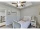 Cozy bedroom featuring plush carpeting, neutral walls, and a tray ceiling at 2022 Raven Way, Atlanta, GA 30341