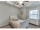Charming bedroom with a tray ceiling, plush carpeting and lots of natural light at 2022 Raven Way, Atlanta, GA 30341