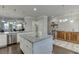 Spacious kitchen with an island, white cabinets, granite countertops, and stainless appliances at 2022 Raven Way, Atlanta, GA 30341