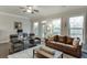 Inviting living room with hardwood floors, natural light, and access to the balcony at 2022 Raven Way, Atlanta, GA 30341