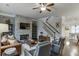 Open living room with a fireplace, staircase, and hardwood floors throughout at 2022 Raven Way, Atlanta, GA 30341