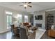 Cozy living room with a stone fireplace, hardwood floors, and ample seating at 2022 Raven Way, Atlanta, GA 30341