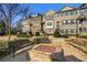 Charming brick townhomes showcasing well-maintained landscaping and a cozy fire pit at 2022 Raven Way, Atlanta, GA 30341