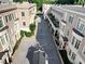 Aerial view of a townhome community reveals immaculately landscaped greenery between the buildings at 2440 Peachtree Nw Rd # 22, Atlanta, GA 30305