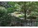 Scenic backyard featuring lush greenery and a tranquil pathway leading to the private outdoor space at 2440 Peachtree Nw Rd # 22, Atlanta, GA 30305