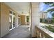 Covered balcony with stone columns, ceiling fan, and city view at 2440 Peachtree Nw Rd # 22, Atlanta, GA 30305