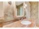 Bathroom vanity with marble countertop and decorative mirror and lights at 2440 Peachtree Nw Rd # 22, Atlanta, GA 30305