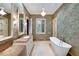 Elegant bathroom with a soaking tub, dual vanity, and a separate glass-enclosed shower at 2440 Peachtree Nw Rd # 22, Atlanta, GA 30305