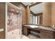 Modern bathroom with tiled shower, stone countertop, and ample cabinet space at 2440 Peachtree Nw Rd # 22, Atlanta, GA 30305