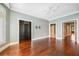 Large bedroom with hardwood floors, and multiple windows with plantation shutters at 2440 Peachtree Nw Rd # 22, Atlanta, GA 30305