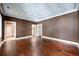 Spacious bedroom featuring hardwood floors, elegant crown molding, and abundant natural light at 2440 Peachtree Nw Rd # 22, Atlanta, GA 30305