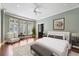 Stylishly furnished bedroom with a sitting area, hardwood floors, and neutral colored walls at 2440 Peachtree Nw Rd # 22, Atlanta, GA 30305