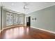 Spacious bedroom featuring hardwood floors, recessed lighting, and plantation shutters at 2440 Peachtree Nw Rd # 22, Atlanta, GA 30305