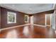 Expansive bedroom with rich hardwood floors, crown molding, and abundant natural light from dual windows at 2440 Peachtree Nw Rd # 22, Atlanta, GA 30305