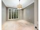 Empty room with travertine floors and window with wooden blinds at 2440 Peachtree Nw Rd # 22, Atlanta, GA 30305