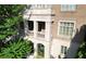 An exterior view of the building features an open-air veranda with columns and brick details at 2440 Peachtree Nw Rd # 22, Atlanta, GA 30305