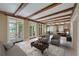 Elegant living room with exposed wood beams and sophisticated furnishings at 2440 Peachtree Nw Rd # 22, Atlanta, GA 30305