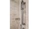 Close up of adjustable shower head on a marble tile wall at 2440 Peachtree Nw Rd # 22, Atlanta, GA 30305