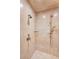 Close up of shower with neutral tile, multiple shower heads, and floor to ceiling glass at 2440 Peachtree Nw Rd # 22, Atlanta, GA 30305
