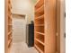 A storage room with floor to ceiling wood shelving and cabinets, ideal for organization at 2440 Peachtree Nw Rd # 22, Atlanta, GA 30305