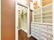 A spacious, well-organized walk-in closet with custom shelving, drawers, and ample storage space at 2440 Peachtree Nw Rd # 22, Atlanta, GA 30305