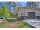 Backyard features a garage with exterior access, a shed and a fenced in area at 3016 Deshong Dr, Stone Mountain, GA 30087