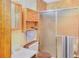 Compact bathroom with a vanity, medicine cabinet, and shower with sliding doors at 3016 Deshong Dr, Stone Mountain, GA 30087