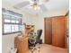 Cozy bedroom with a fan, window, and desk area at 3016 Deshong Dr, Stone Mountain, GA 30087