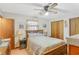 Cozy bedroom features a ceiling fan and a window at 3016 Deshong Dr, Stone Mountain, GA 30087