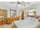 A well-lit bedroom features a full-size bed, dresser, and window at 3016 Deshong Dr, Stone Mountain, GA 30087