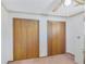 Simple bedroom featuring double closets and carpeted flooring at 3016 Deshong Dr, Stone Mountain, GA 30087