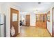 Open dining area with chandelier, hutch, and access to a living space and kitchen at 3016 Deshong Dr, Stone Mountain, GA 30087