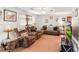 Cozy living room features a ceiling fan, plush sofas, and modern entertainment center at 3016 Deshong Dr, Stone Mountain, GA 30087