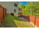 Spacious backyard with lush green grass and a privacy fence at 1030 Blankets Creek Dr, Canton, GA 30114