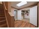 Finished basement area with wood-look flooring, access to stairs, and a large storage closet at 1030 Blankets Creek Dr, Canton, GA 30114