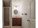 Cozy bathroom features a vanity with decorative mirror and lighting, and a walk-in shower at 1030 Blankets Creek Dr, Canton, GA 30114