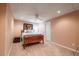 Well-lit bedroom features carpet floors, neutral walls, a ceiling fan, and a double bed at 1030 Blankets Creek Dr, Canton, GA 30114