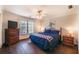 Comfortable bedroom with a window view and an inviting blue comforter atop the bed at 1030 Blankets Creek Dr, Canton, GA 30114