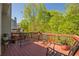 Outdoor deck area with seating and a view of the surrounding greenery at 1030 Blankets Creek Dr, Canton, GA 30114
